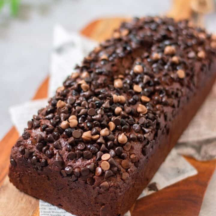 eggless double chocolate banana bread placed on a wooden serving board