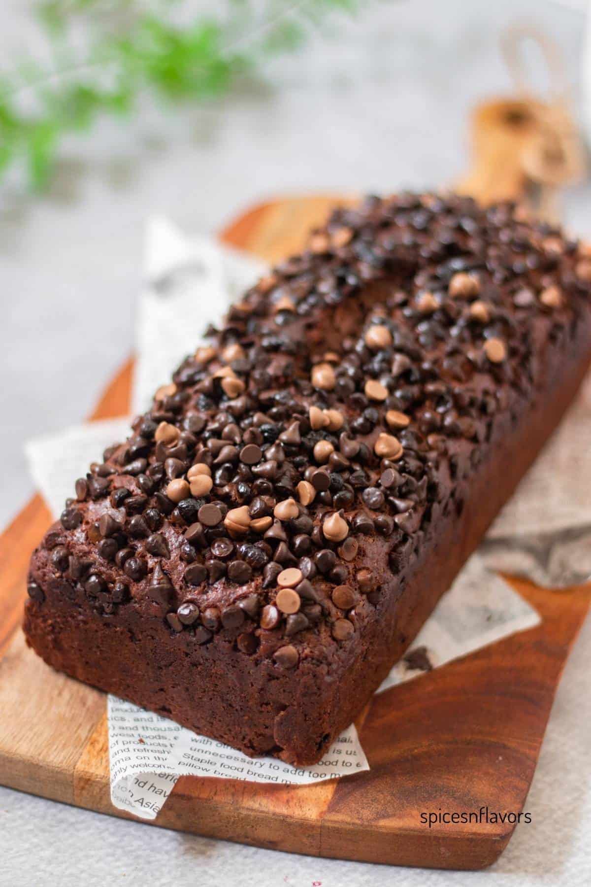 eggless double chocolate banana bread placed on a wooden serving board