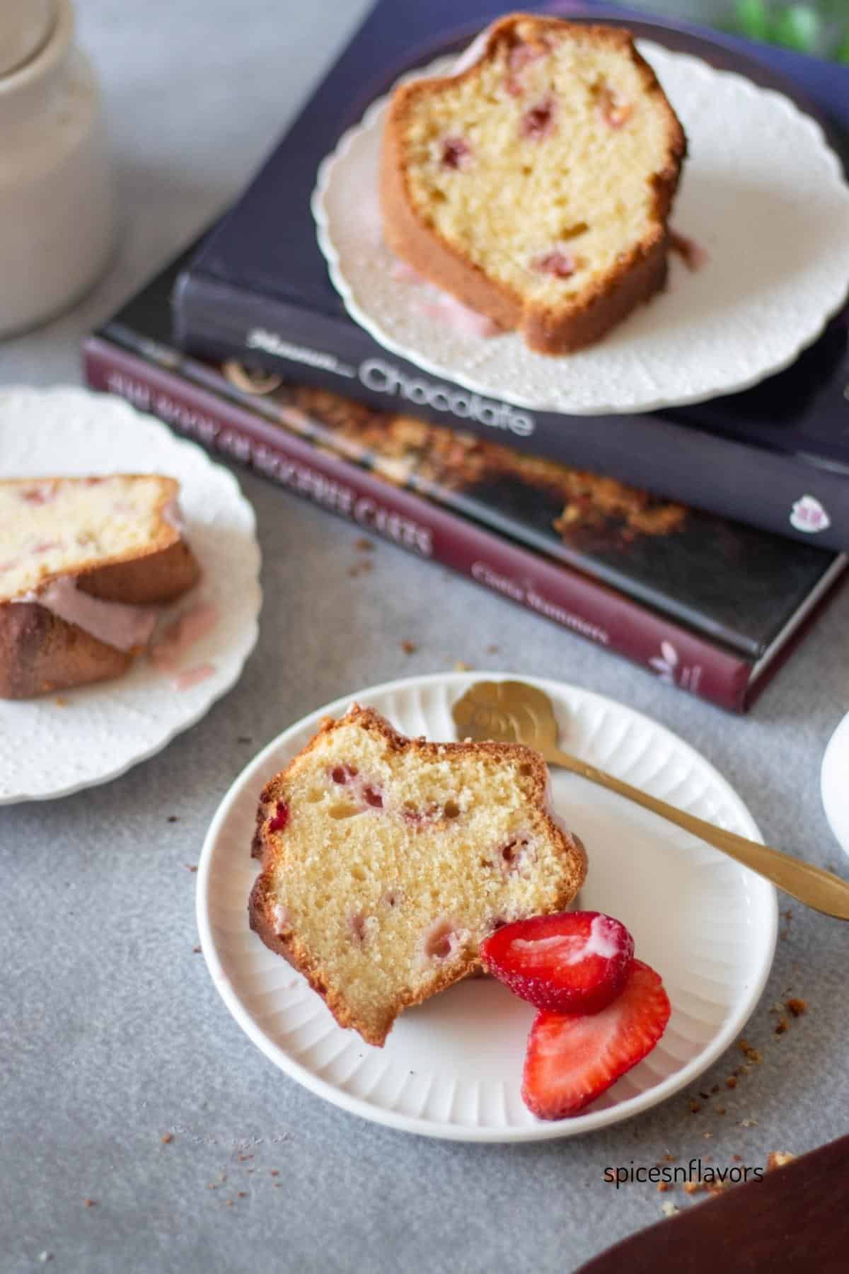 3 slices of strawberry pound cake placed on 3 different ceramic plate