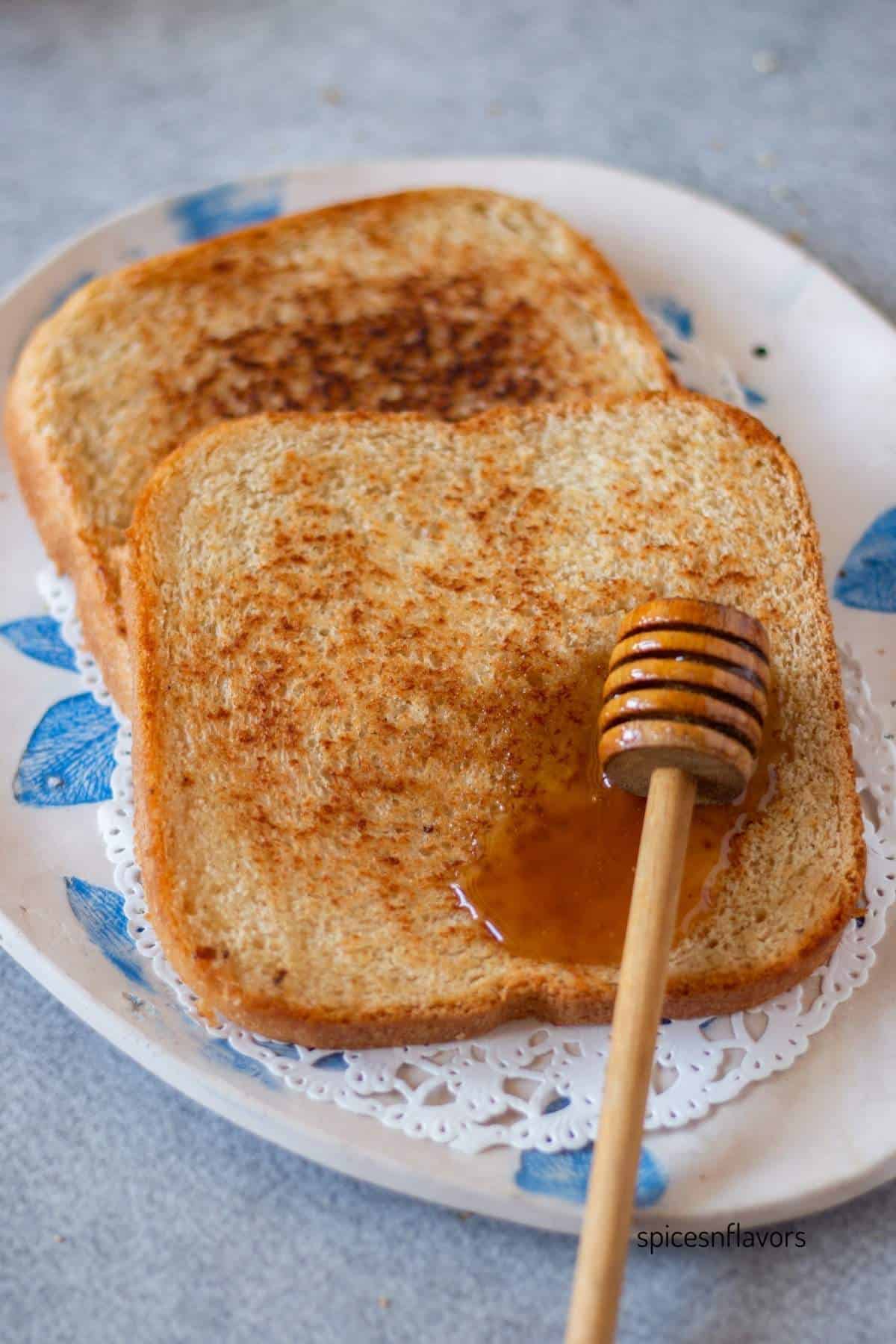 sliced honey wheat bread served with honey