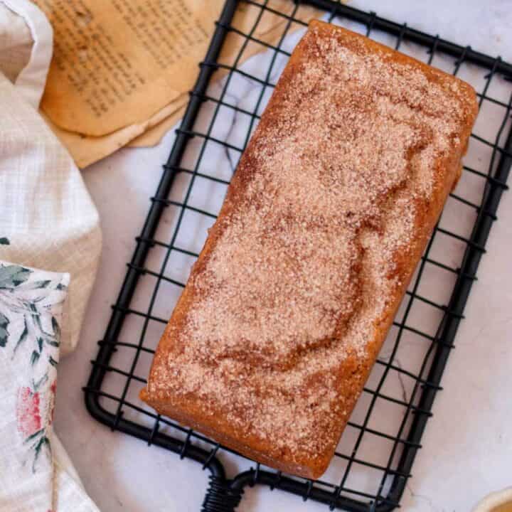 baked cinnamon sugar donut bread placed on a wire rack