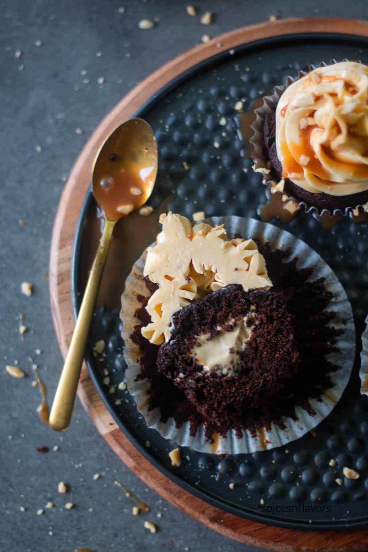 close up overhead image of sliced coffee cupcake with custard filling and caramel frosting to show the texture