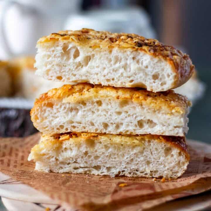 three slices of italian cheese bread placed on one top of the other