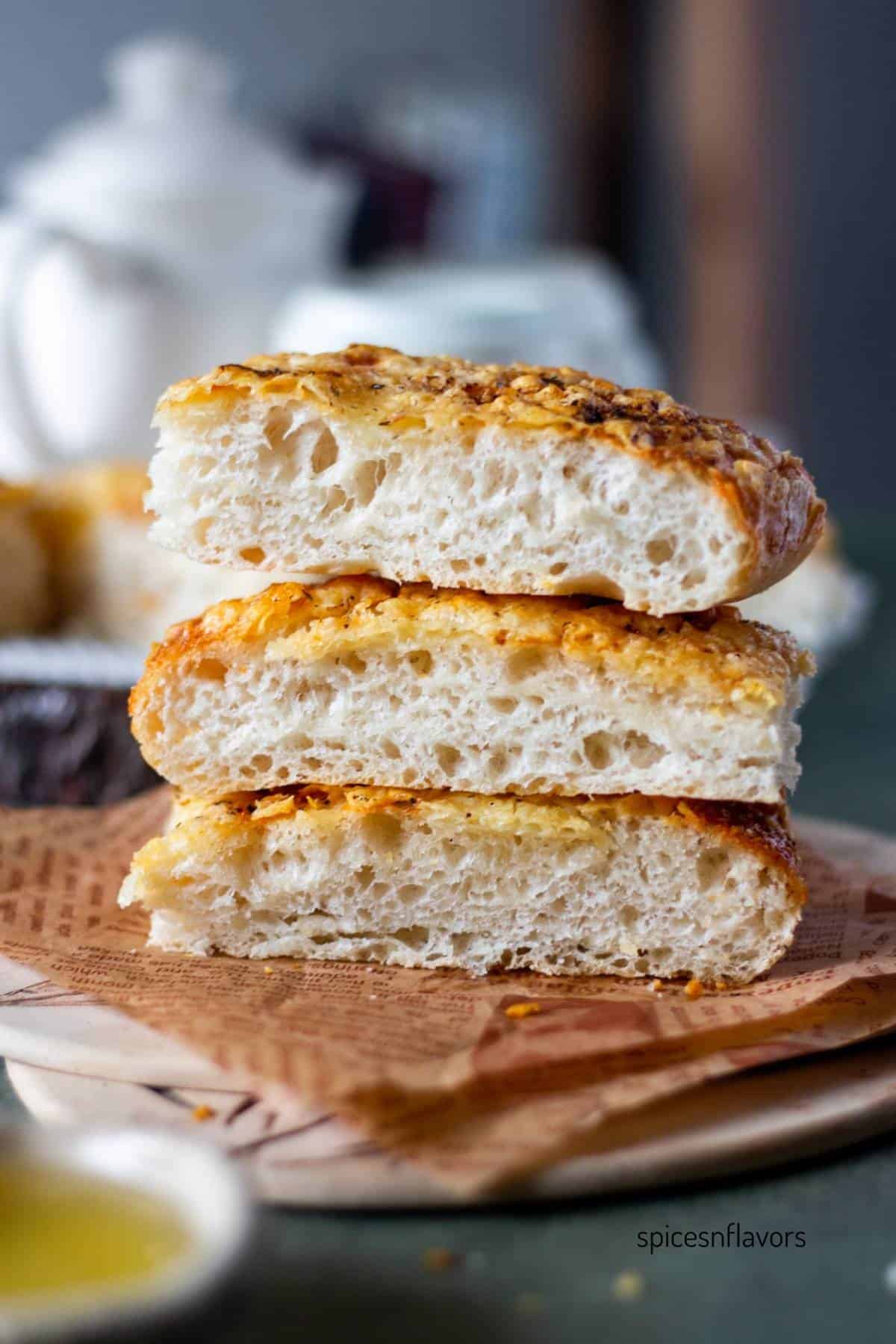three slices of italian cheese bread placed on one top of the other