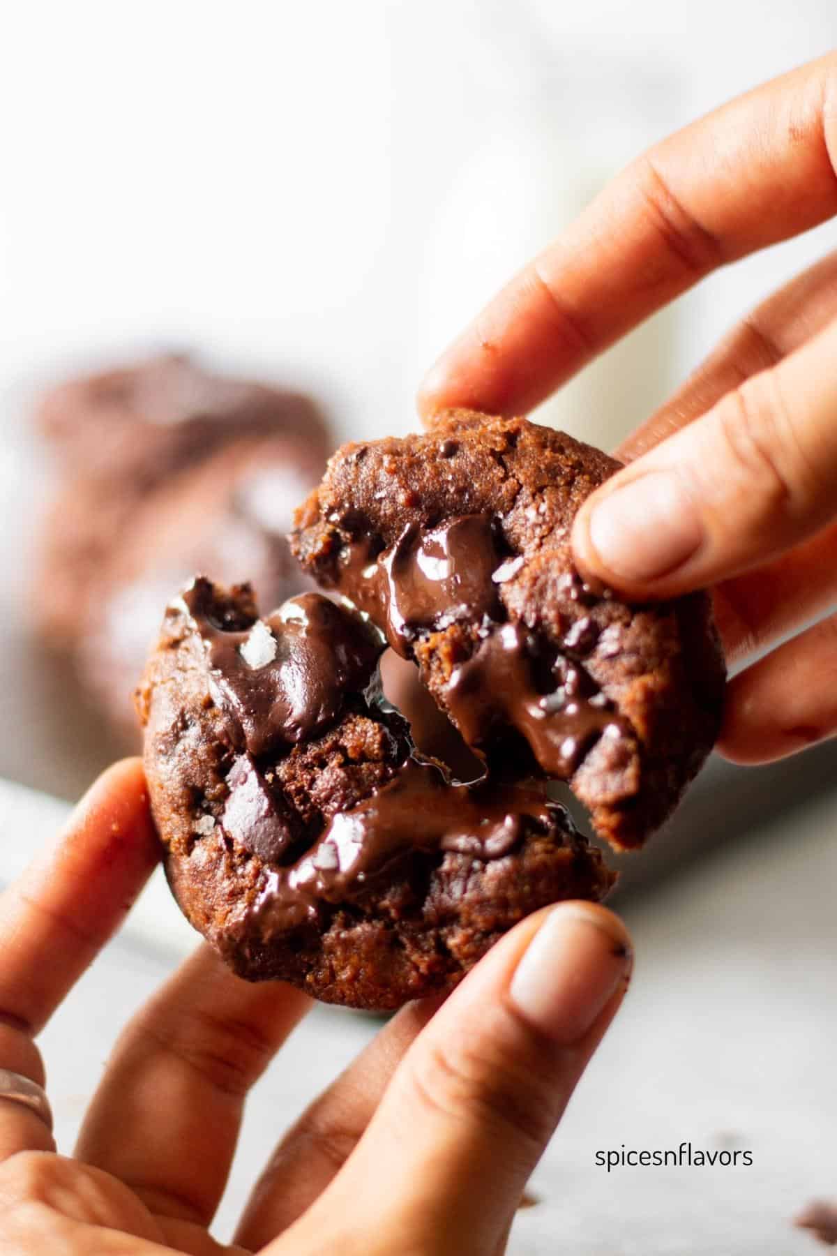 slicing the espresso cookie by pulling it apart using both the hands