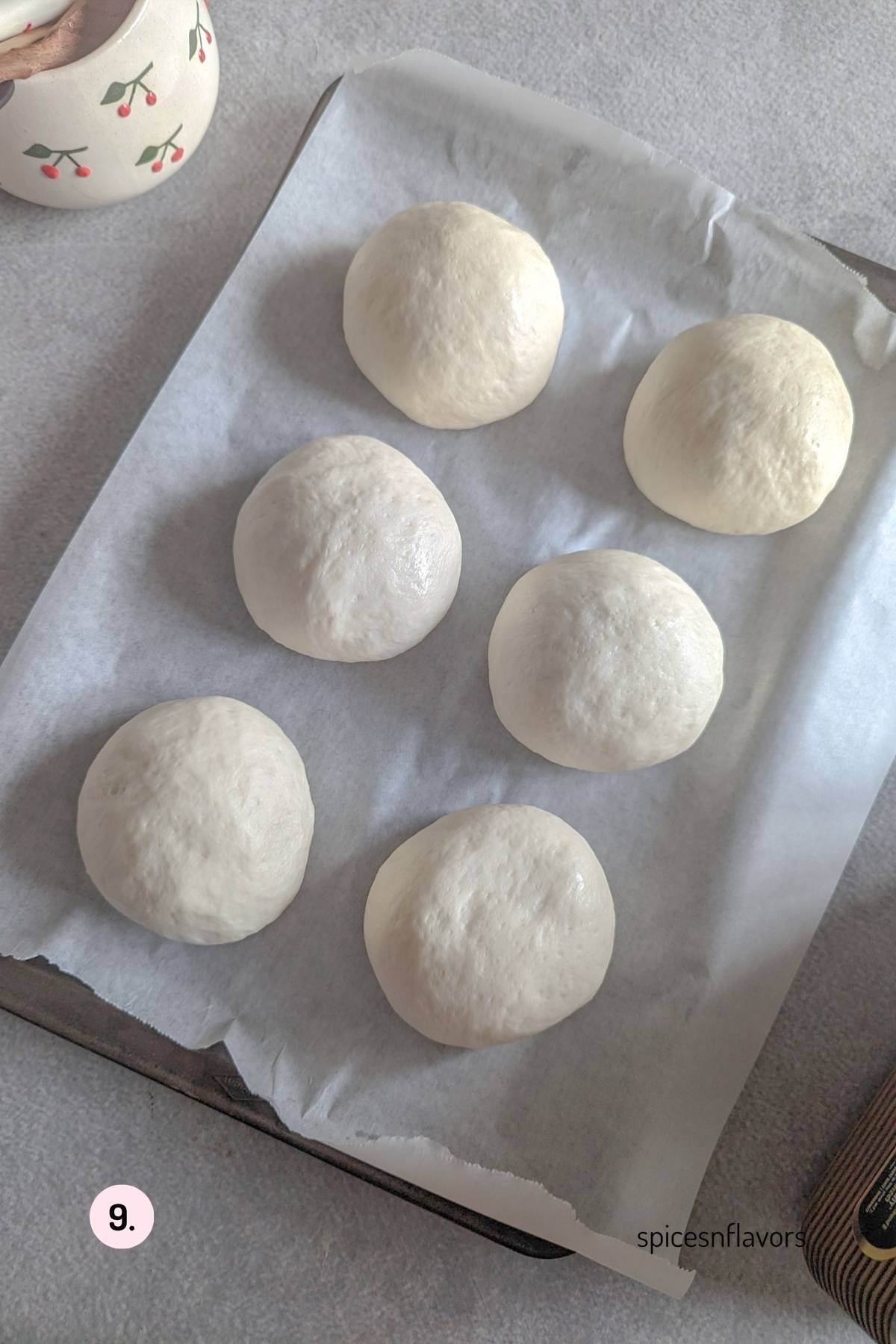 shaped and proved doughnut on baking tray