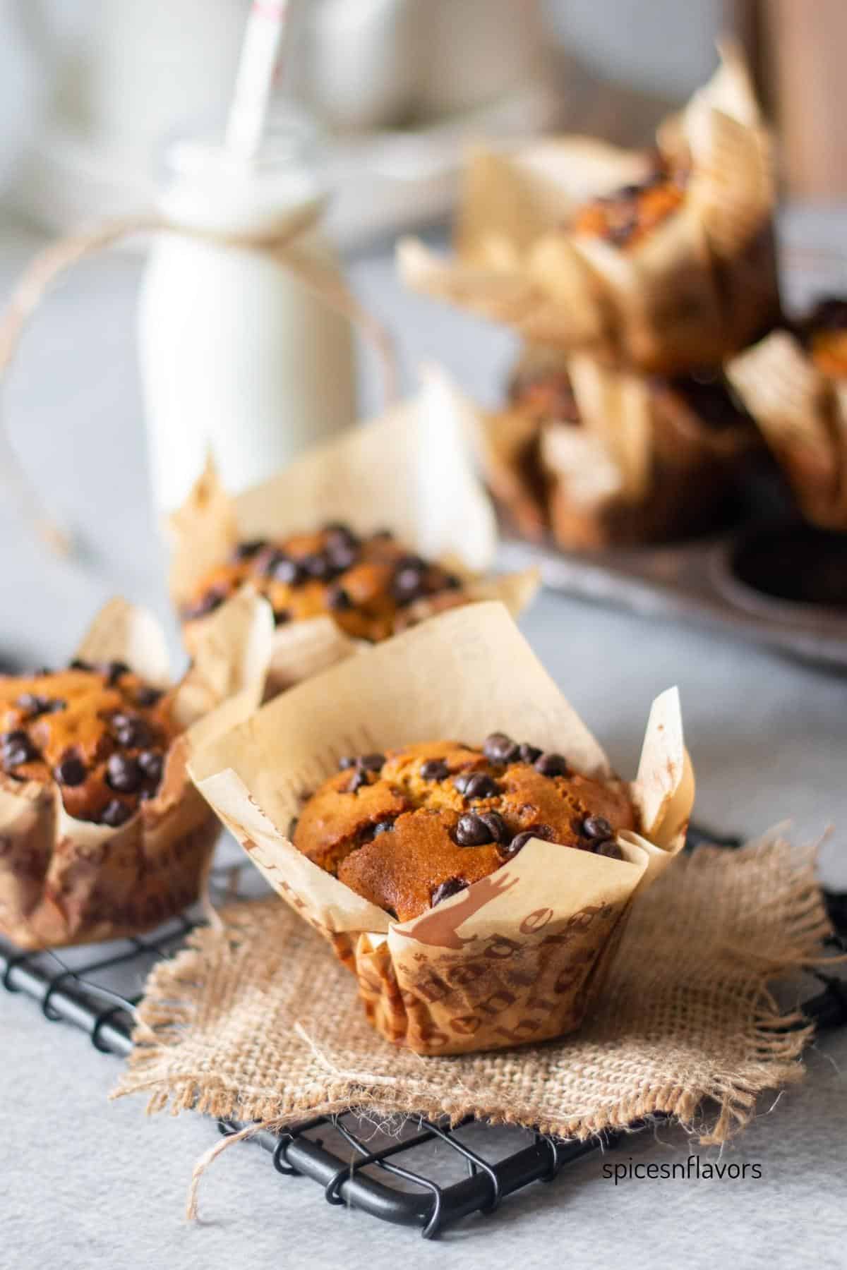 baked whole wheat muffins placed on a wire rack