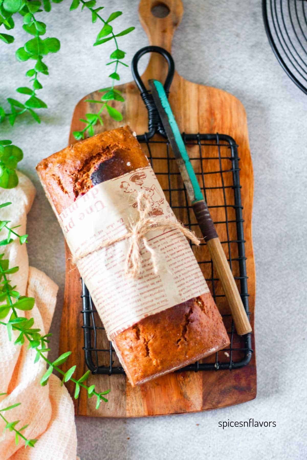 banana bread loaf placed on a wire rack