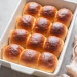close up image of baked dinner rolls for recipe card
