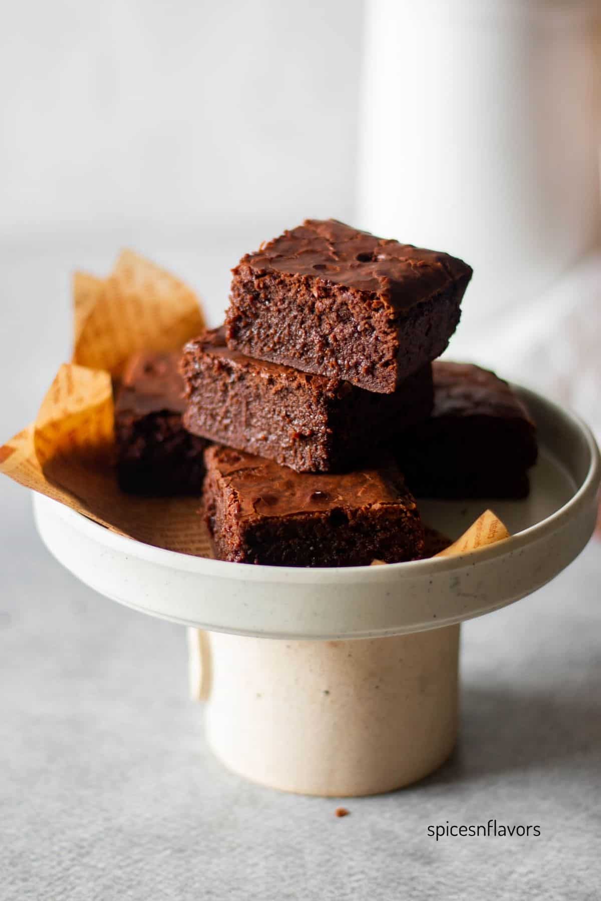 stacked brownies placed on mini diy cake stand