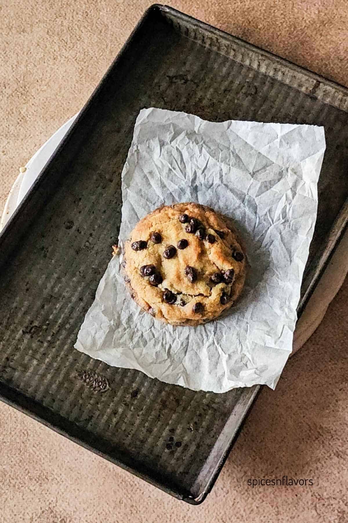 baked single serving chocolate cookie on baking tray
