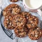 close up image of eggless chocolate chip cookies placed on wire rack to fit recipe card image size