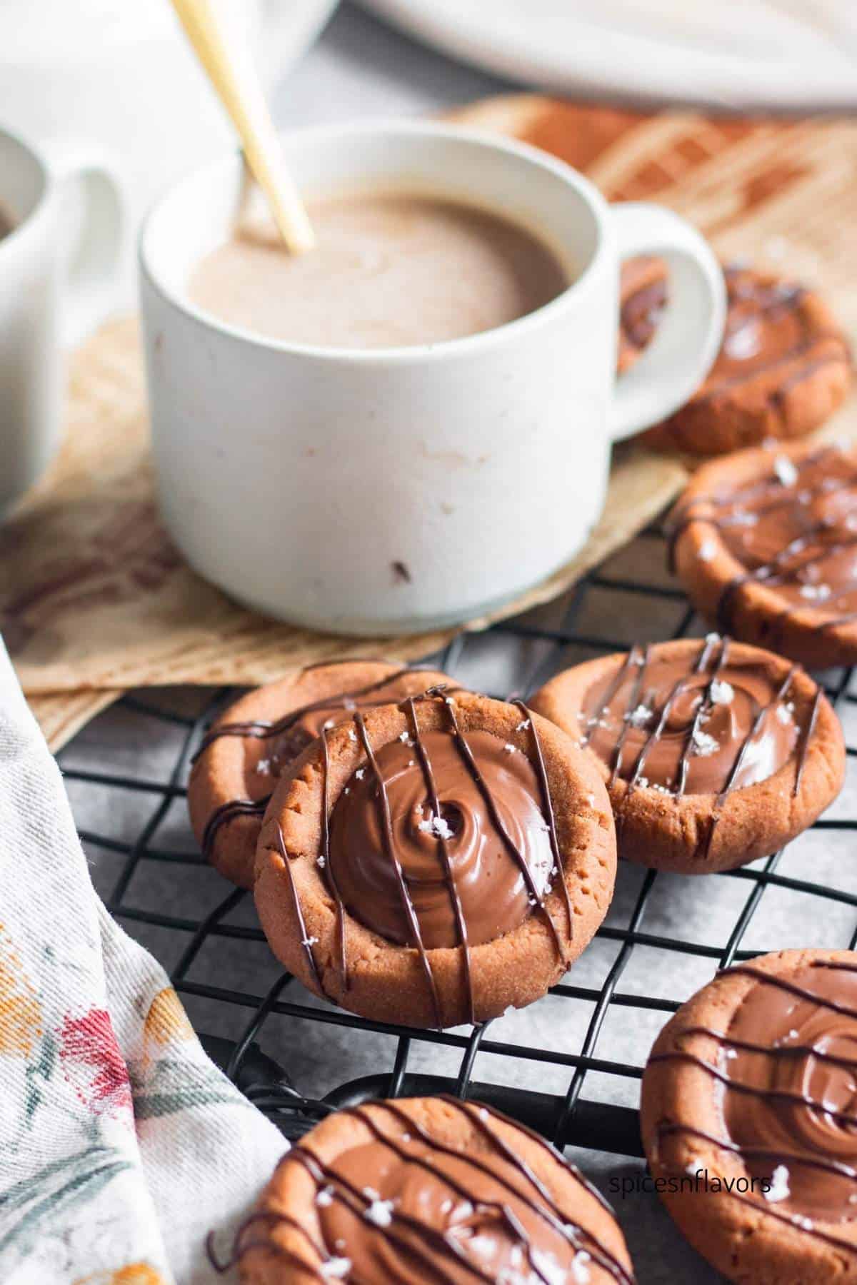 one chocolate condensed milk cookies with coffee in the background