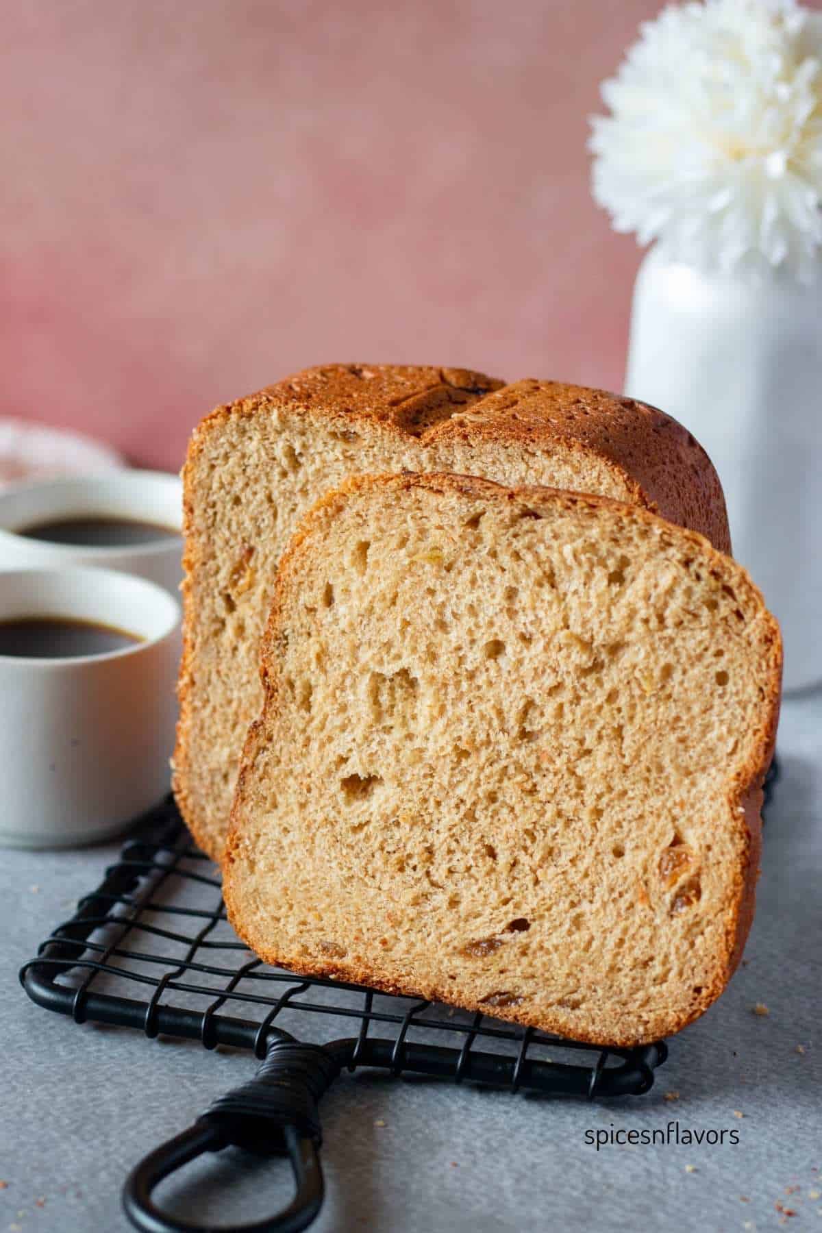 sliced cinnamon raisin bread machine bread on wire rack
