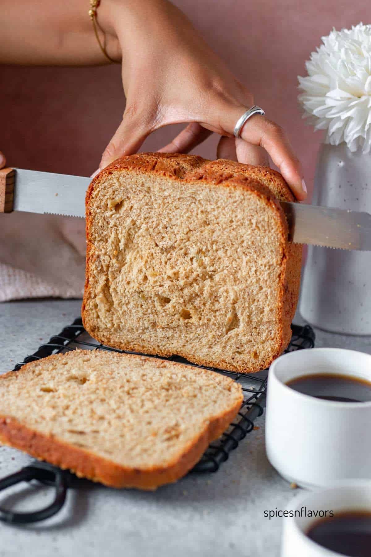 slicing the cinnamon raisin bread using bread knife