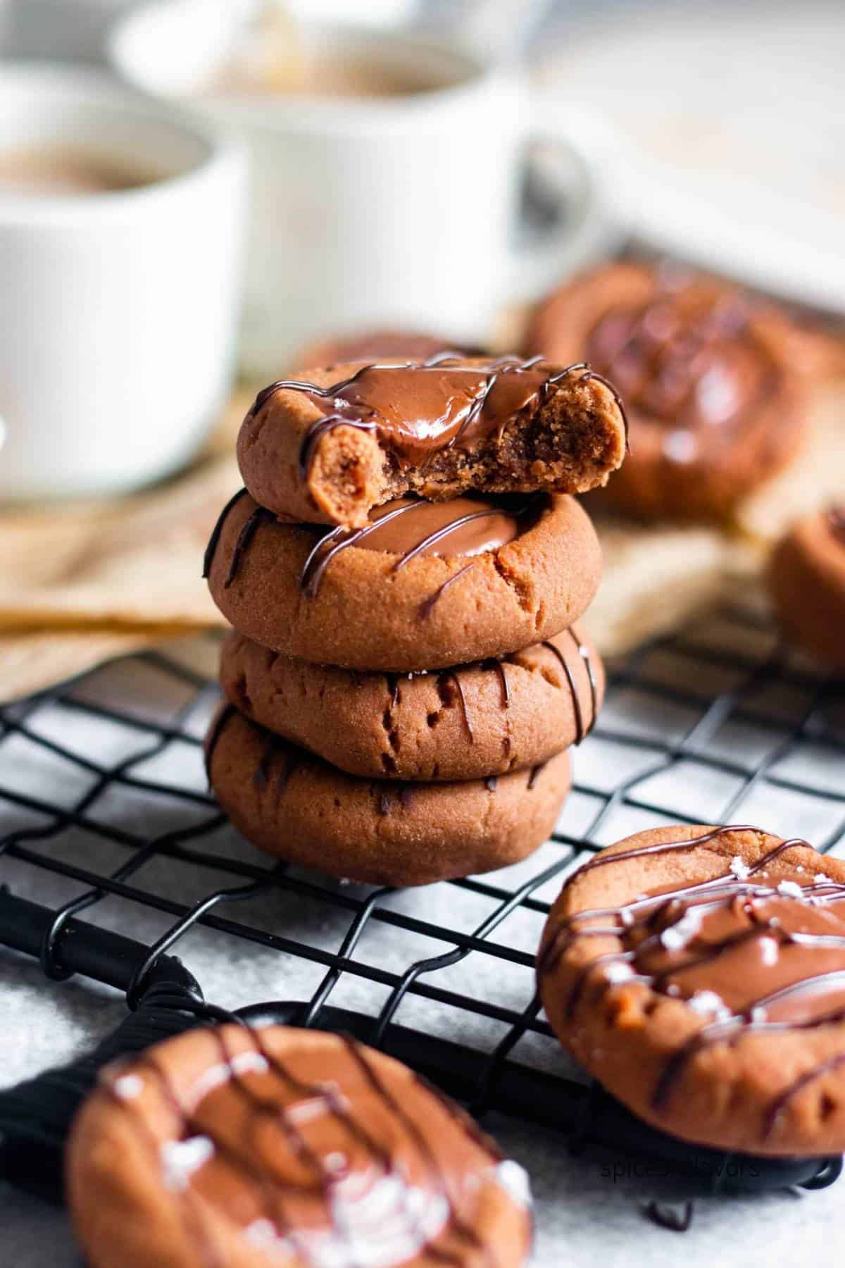 stacked condensed milk chocolate cookies on wire rack