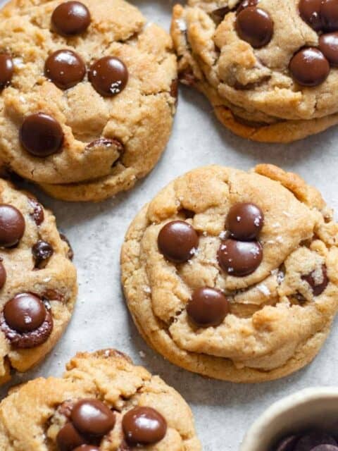 close up image of chocolate chip cookies in a baking tray to fit the recipe card image