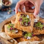 close up image of picking up a nutella puff pastry square for recipe card
