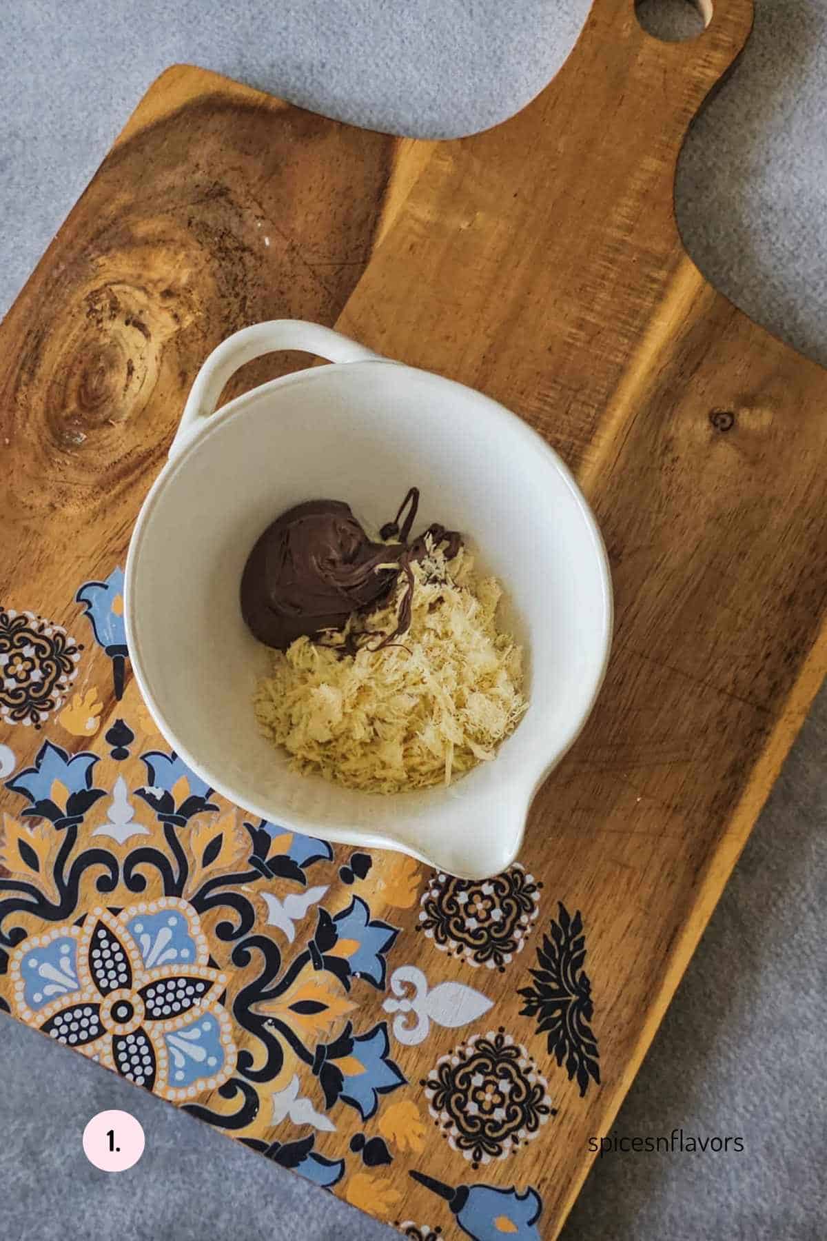 mixing soan papdi and nutella in a bowl