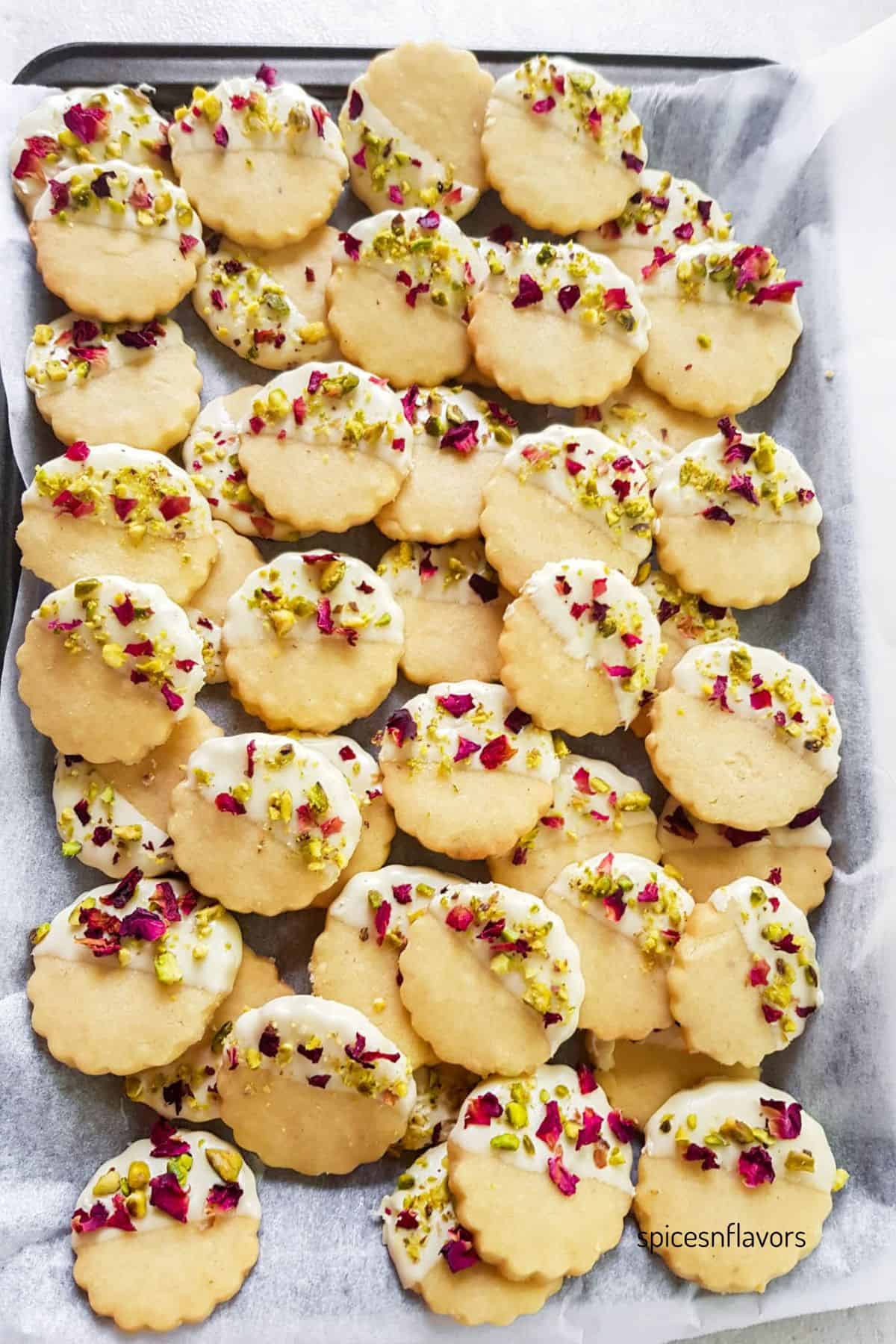 baked rose and pistachio cookies placed on a baking tray