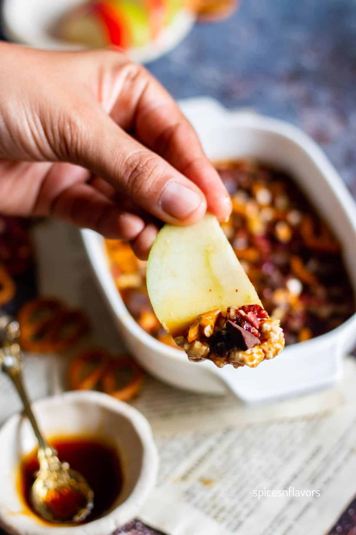 caramel dip on an apple slice