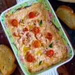 close up image of baked feta dip in casserole for recipe card