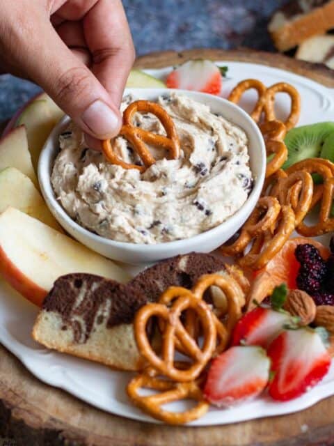 close up image of pretzel dipped in chocolate chip dip for recipe card