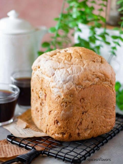 baked cranberry walnut bread made in bread machine placed on a wire rack