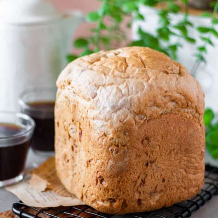 baked cranberry walnut bread made in bread machine placed on a wire rack