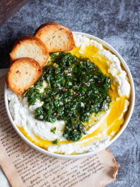 whipped ricotta dip with herbed oil on top