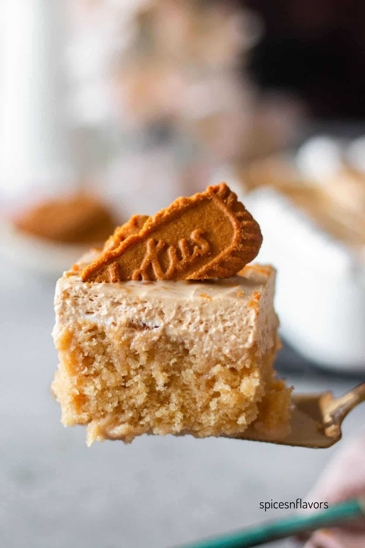 biscoff tres leches cake sliced placed on a cake server