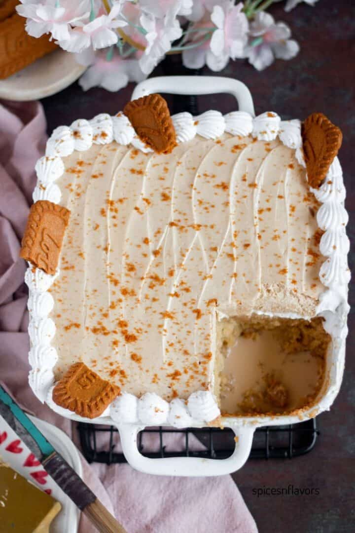 a piece of biscoff tres leches cake removed from cake pan