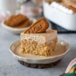 close up image of biscoff tres leches cake placed on a plate to fit recipe card