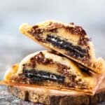 close up image of sliced oreo stuffed chocolate chip cookie placed on top of each other for recipe card image