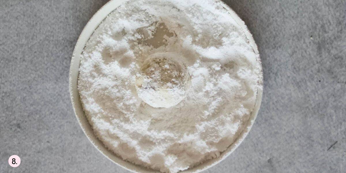 roll the cookies in powdered sugar