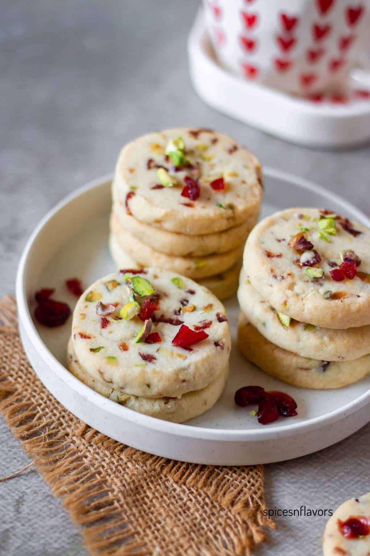 cranberry pistachio cookies placed on a white plate