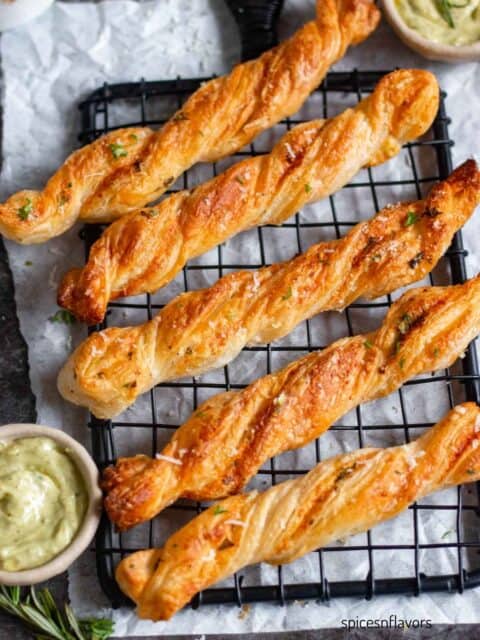 puff pastry garlic twists placed on a wire rack