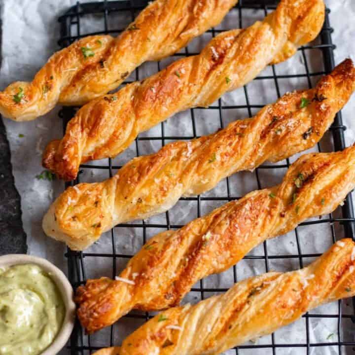 puff pastry garlic twists placed on a wire rack
