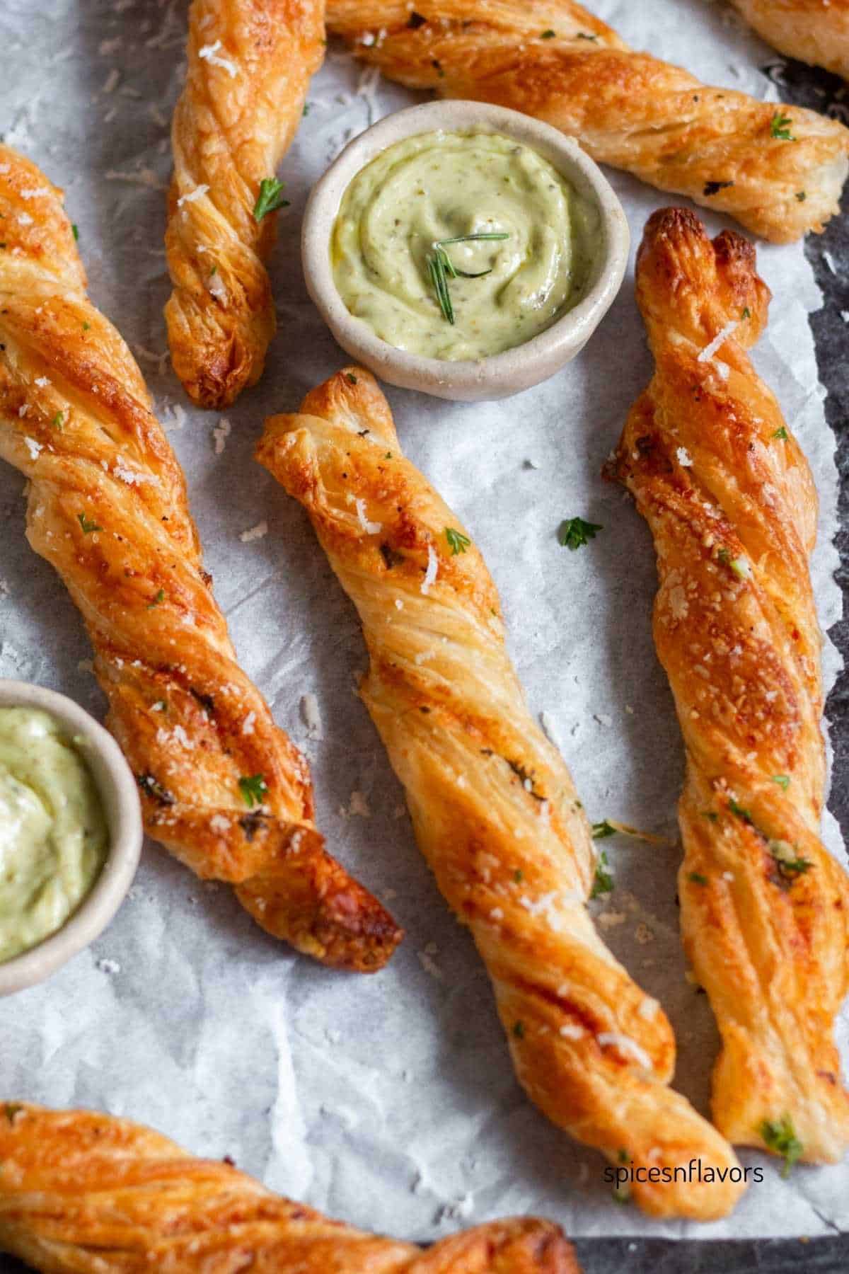 garlic puff pastry twists placed on baking tray