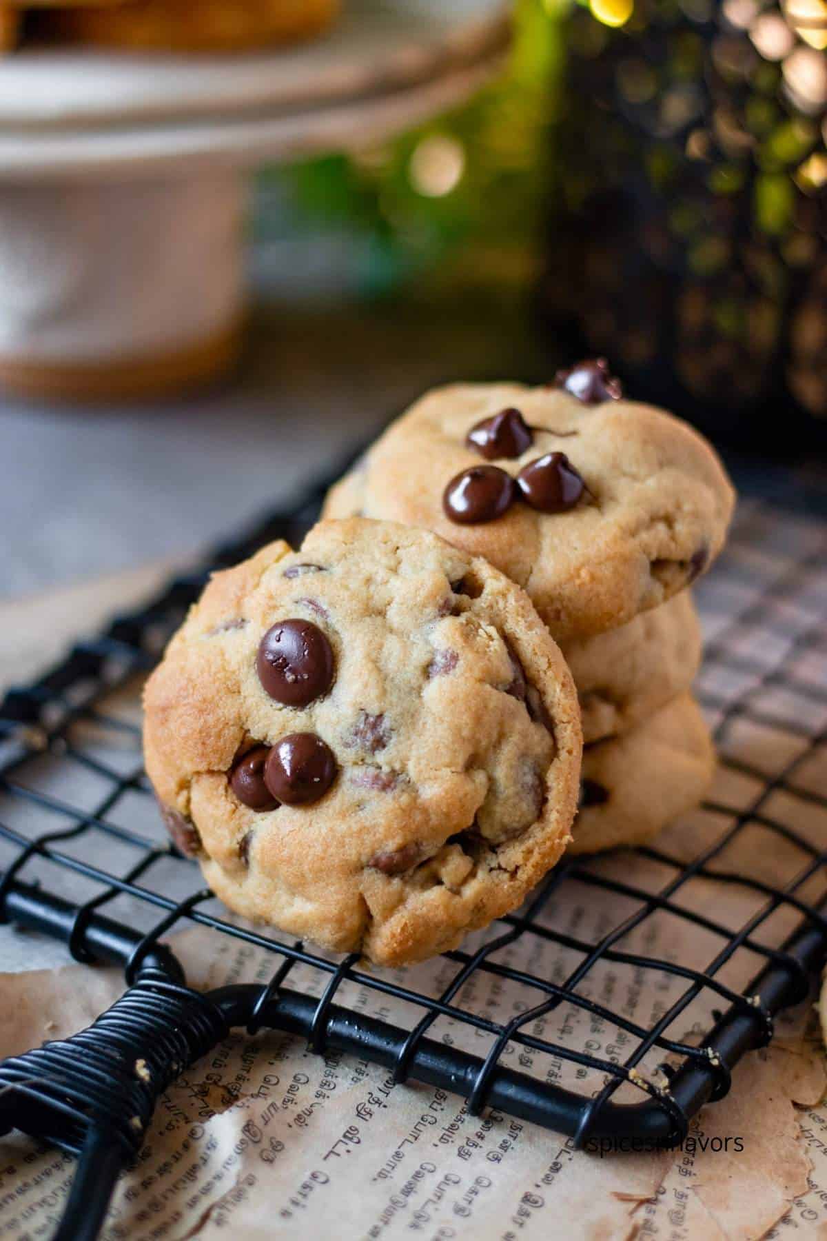 one peanut butter chocolate chip cookie placed in front of stack of cookies