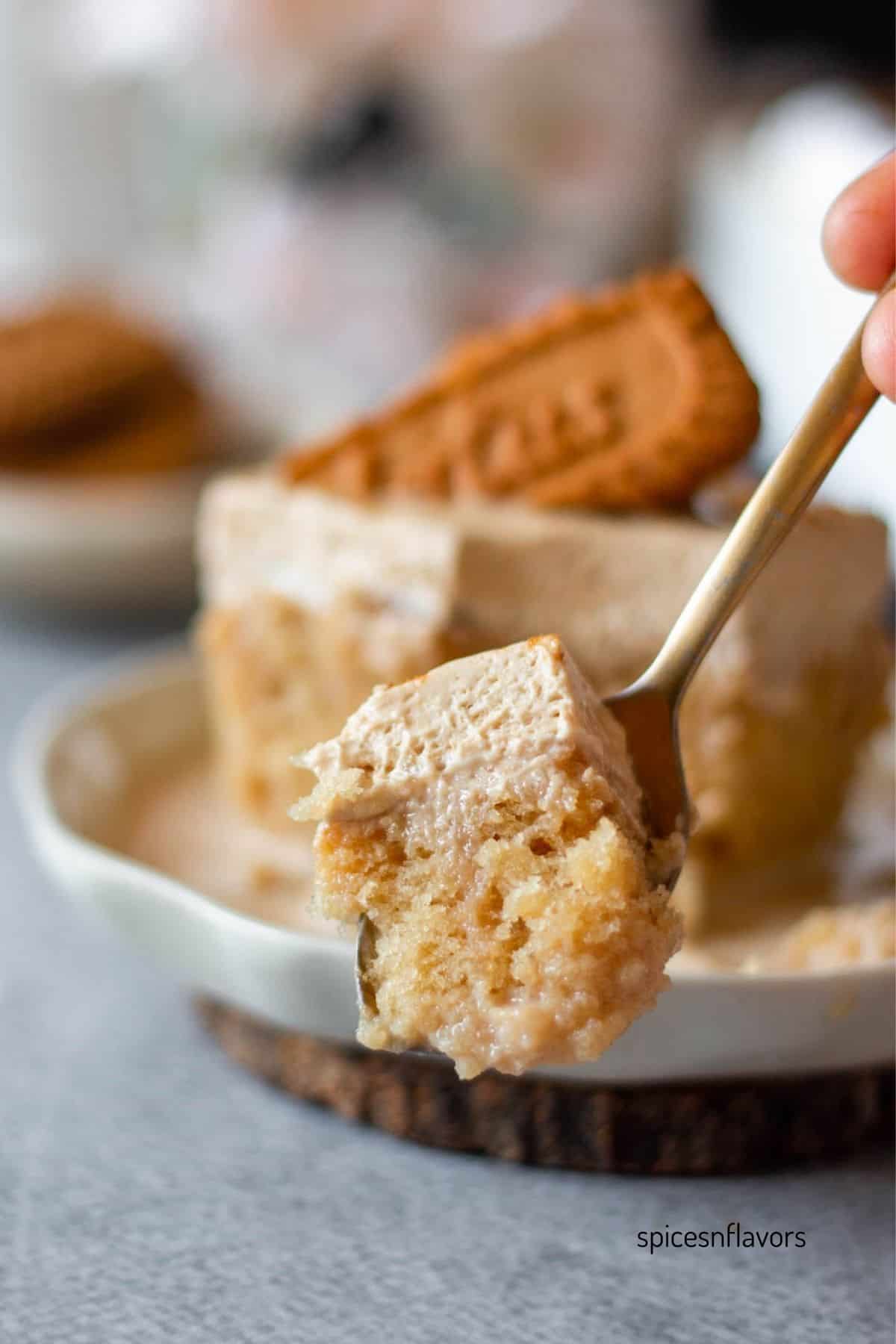 spoonful of biscoff tres leches cake sliced from the cake