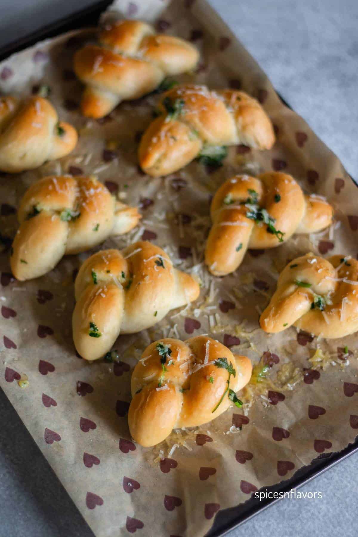 baked garlic knots in baking tray