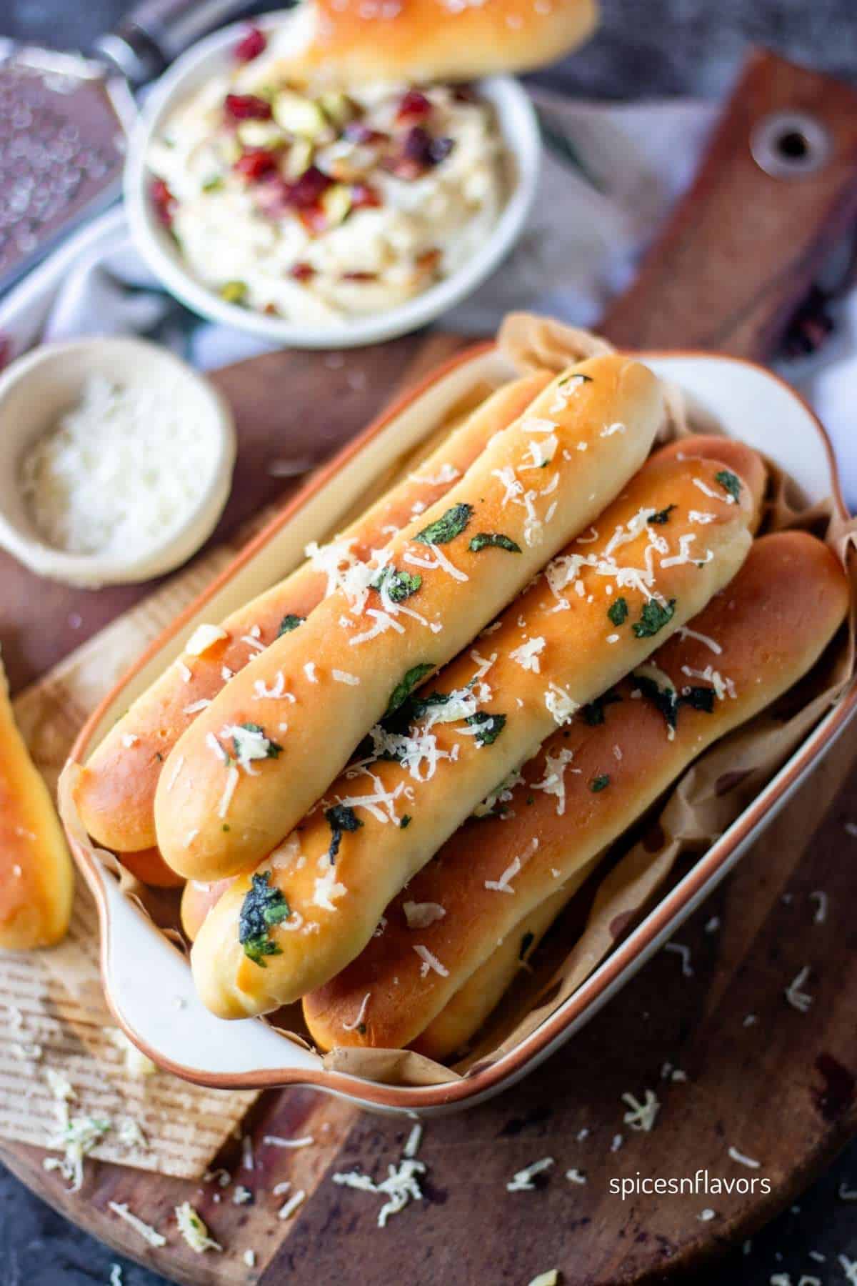 garlic breadsticks placed in an oval pan
